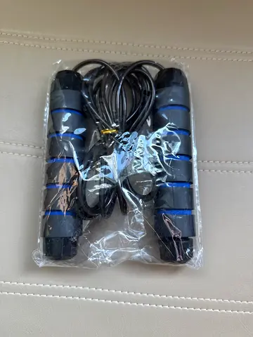 Adjustable skipping rope with comfortable grip handles - new