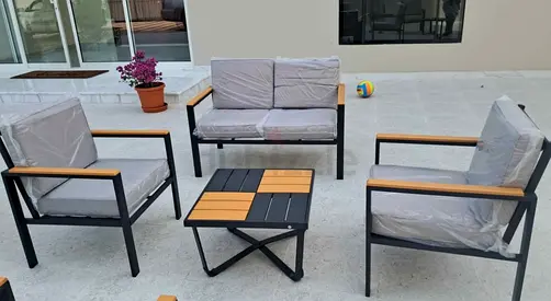 4-piece outdoor patio lounge set with cushions and coffee table