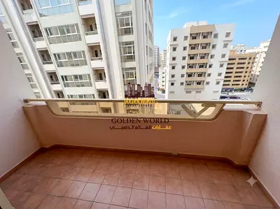 One bedroom apartment with a living room for rent in Al Qasimia for AED 30,000 with a balcony open