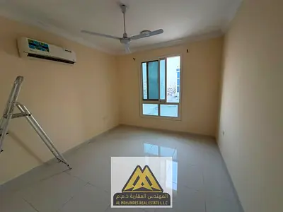 1BR + living room in Al Muwaihat 2, balcony, 1 bath, split AC, free maintenance, family building, A