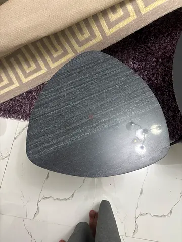 Black triangular side/coffee table in good condition