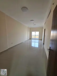 Two bedrooms and a spacious living room for rent in Al Jurf 3, high-end deluxe finishing, close to a