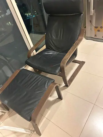 Ikea leather reclining armchair with matching footstool - wooden frame