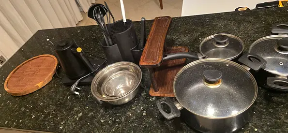 Used mixed cookware set — pots, pans, lids and accessories
