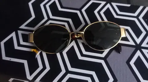 Gold oval-frame sunglasses, gently used