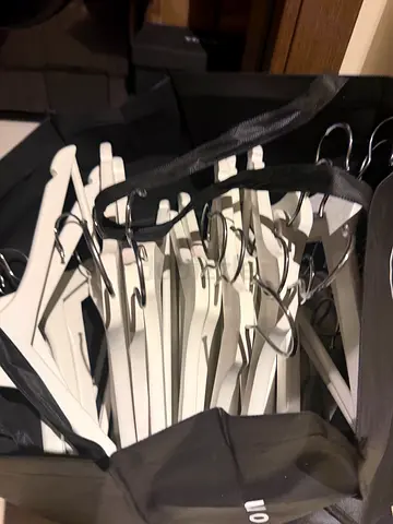 Set of white wooden clothes hangers (about 40) - good condition