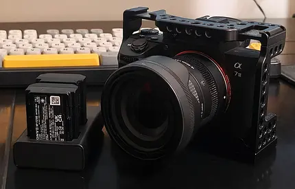 Sony a7 III with Sigma 18-50mm f2.8 lens, cage and spare batteries (Used)