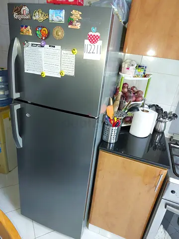 Used double-door refrigerator in good condition — stainless steel finish