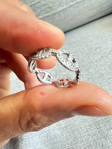 Apm Monaco Silver-tone linked eternity ring with cubic zirconia accents