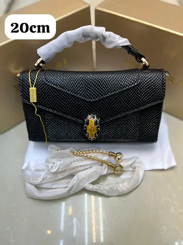 Black textured leather shoulder bag with snake head clasp - 20cm