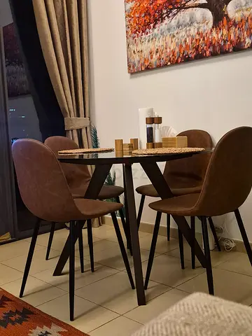 Dining table with 4 brown upholstered chairs - good condition of table