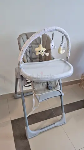 Used baby high chair with toy bar and removable tray