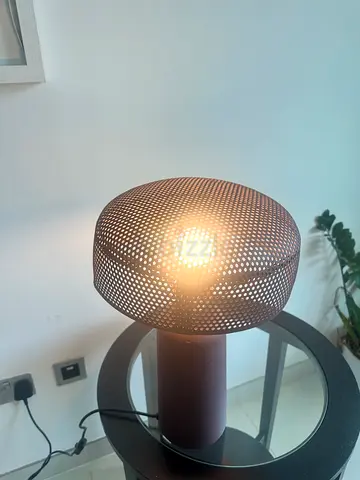 Modern perforated metal table lamp - brown/black, working