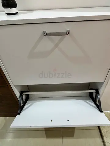 Small white shoe cabinet with pull-out tray