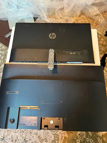 Two used computer monitors - HP and Samsung ( screen broke)