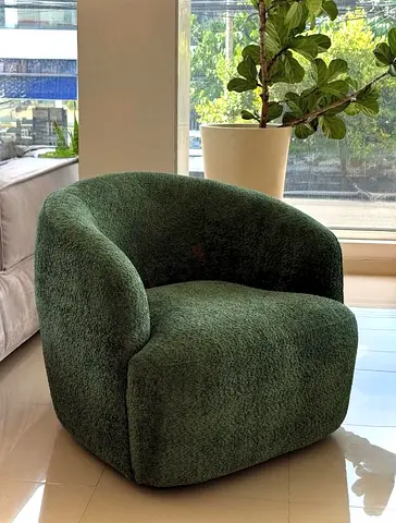 Green boucle lounge armchair — cozy single-seater