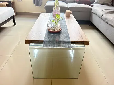 Modern glass-end wooden coffee table — light oak finish