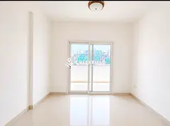 Spacious 2BR Apartment | Al Marsoumy Building | Balcony & City Views