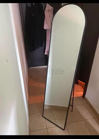 Full-length freestanding arched mirror with black metal frame - good condition
