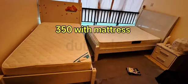 Two single beds with mattresses