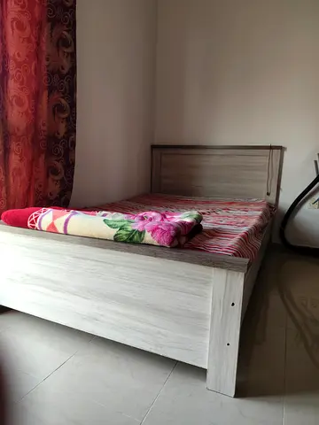 Double sizedwooden bed frame with headboard - light oak finish and 2 mattresses ortho for urgent sal
