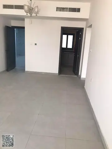 Brand new apartment, two bedrooms, living room with balcony, spacious layout, in Al-Aliya, near Mohammed Bin Zayed Road.