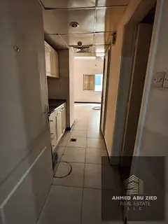 A distinctive studio for rent in Al Nuaimiya 2 - Ajman, spacious, separate kitchen, central AC open