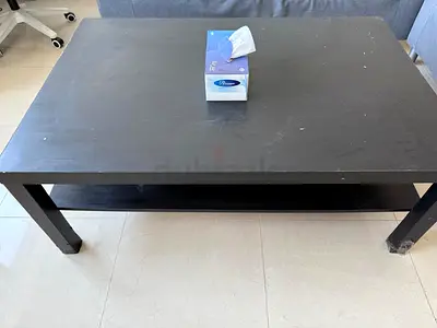 Simple black wooden coffee table with lower shelf