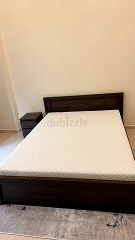 Queen bed frame with silent night mattress and nightstand