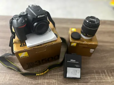 Nikon D3500 Complete Photography Kit with 18-55mm & 420-800mm lenses, box and charger, tripod