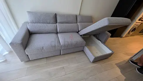Eskilstuna L shape sofa bed with storage