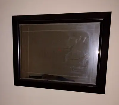 Wall-mounted framed mirror - dark wood frame