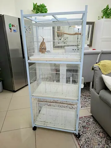 Three-level white bird cage on wheels — good condition