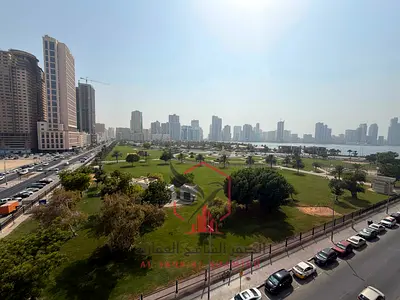 Beautiful sea view, one month free, largest two-bedroom apartment with a large balcony and spacious hallway, easy access to Dubai, for rent in Al Maja