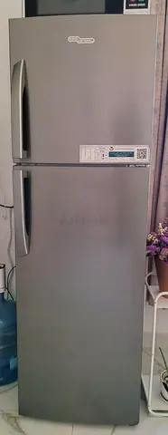 Silver top-freezer refrigerator - good condition