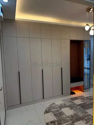 Built-in Modern Gray Wardrobe with Seating Nook