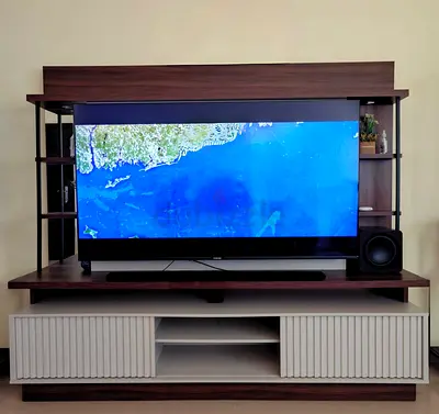 Wood and white TV entertainment unit with shelving