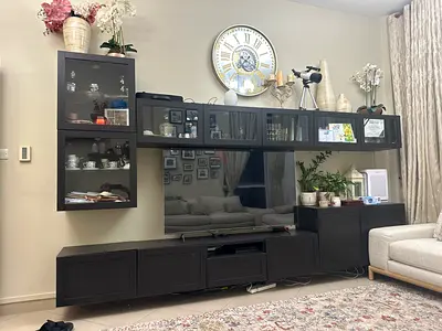 Dark wood modular entertainment center with wall cabinets