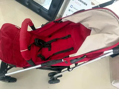 Red lightweight baby stroller / pram in good used condition