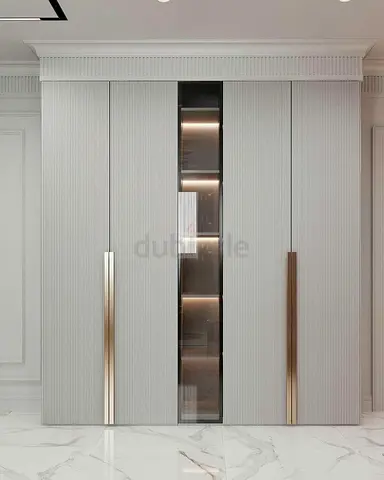 Modern built-in wardrobe with vertical fluted doors and central display panel