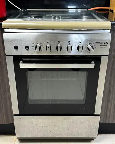 Daewoo Electronics cooking range/gas cooker, featuring a 4-burner cooktop, an integrated gas oven