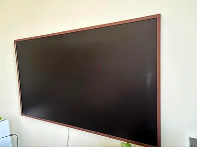 55-inch Samsung frame LED TV wall-mounted in excellent condition QA55LS03BAU