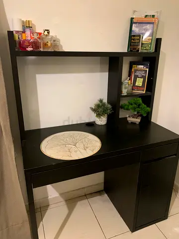 Black desk with shelving unit - good condition with black chair.
