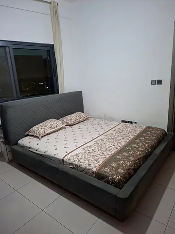 Grey Upholstered King Bed with Padded Headboard - Good Condition