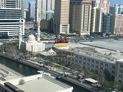 2BR apartment for annual rent in Al Khan, Sharjah. Free AC, 2 master bedrooms, parking, gym, pool, Al Qasba view, balcony. AED 67,000/year.