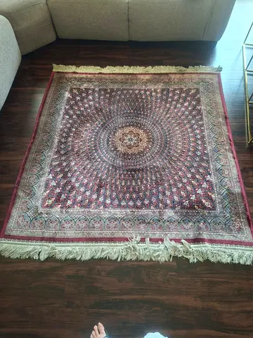 Maroon carpet with intricate design