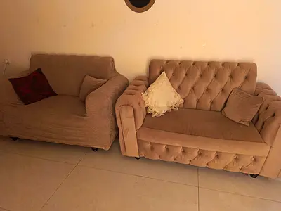 3 typical of 2-Seater Sofas in Beige with their sofa covers — in Good Condition.