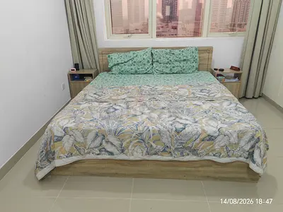 King size wooden bed frame with 10 inch spring mattress and bedside tables - good condition
