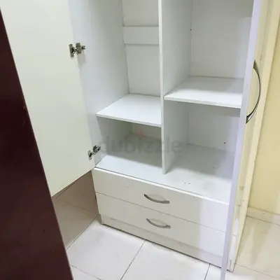 Urgent Sale: A White Two-Door Storage Cabinet / Wardrobe with Shelves