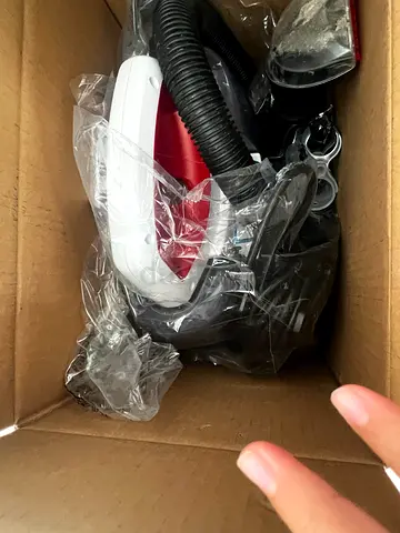 Compact handheld vacuum cleaner with hose and attachments - used 1 time